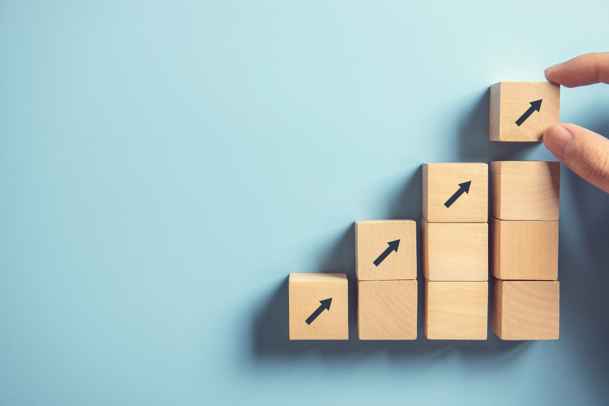 arrows pointing upwards on wooden blocks