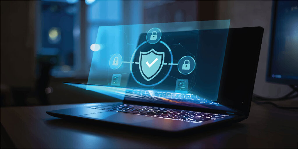 Holographic digital security shield and network icons projected from a laptop screen, signifying online protection and cybersecurity, data protection